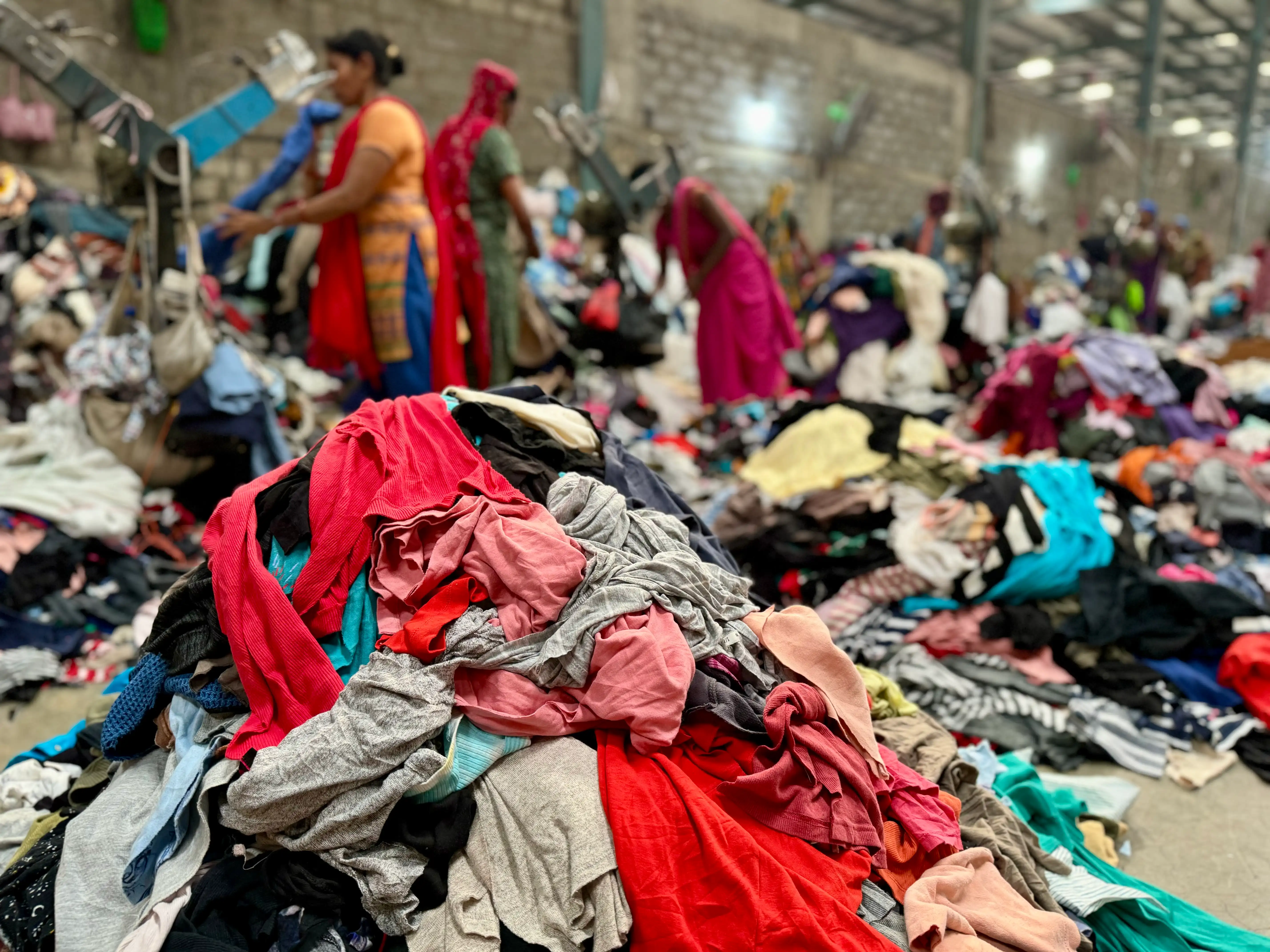 a big lot of used clothing ready to cut for clippings