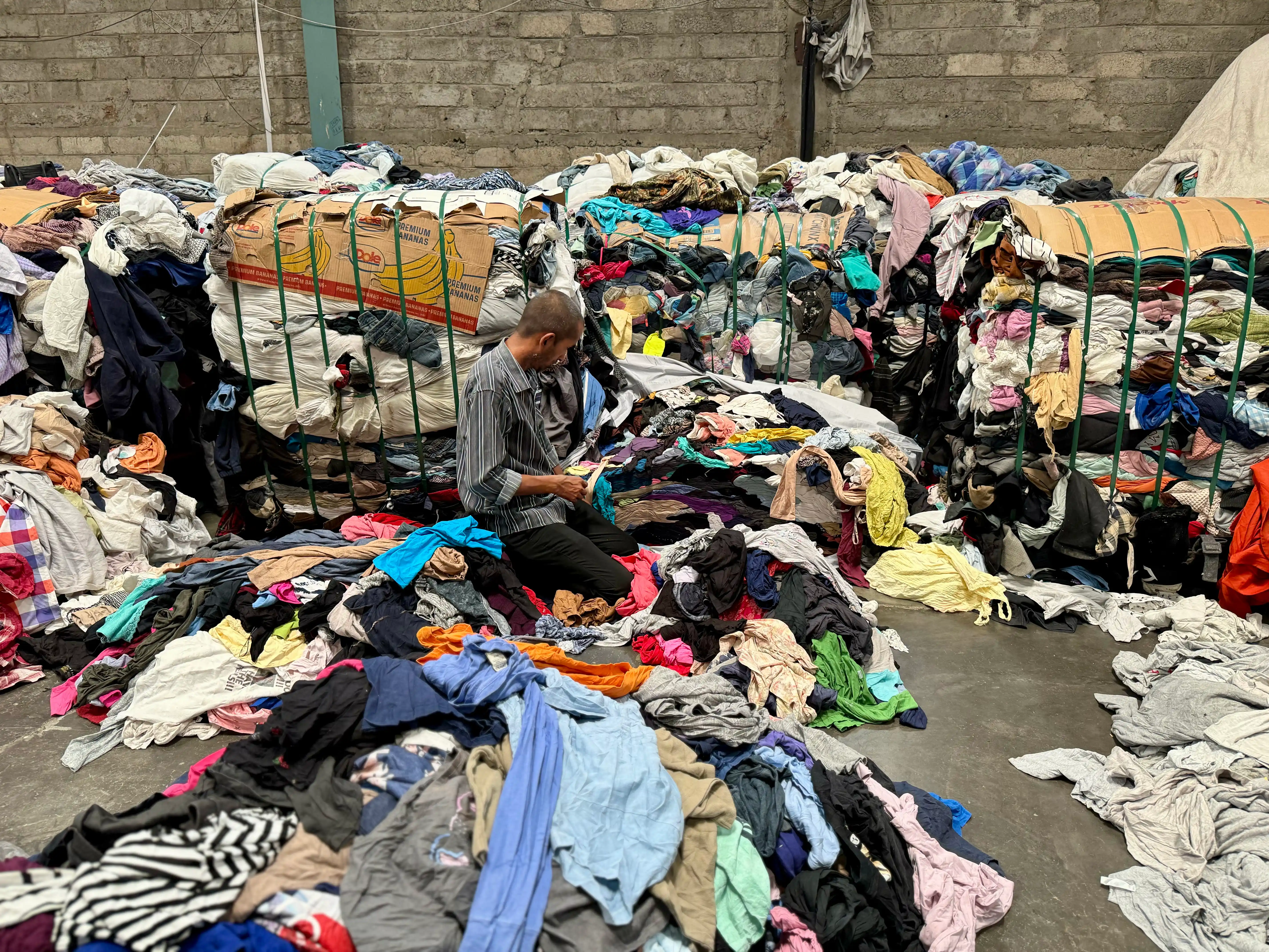 clothing being sorted to cut for clippings