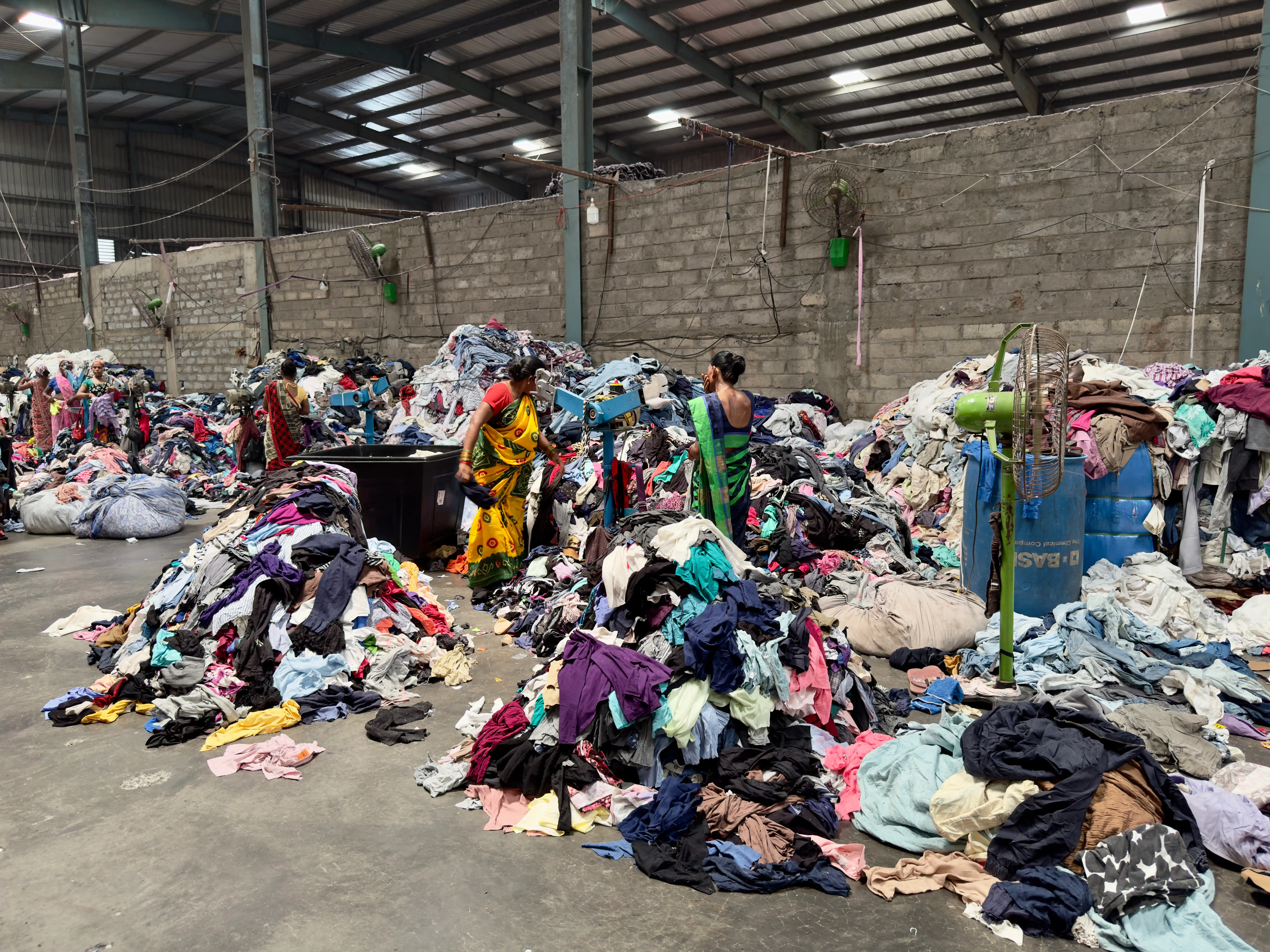 wide view of clothing being cut