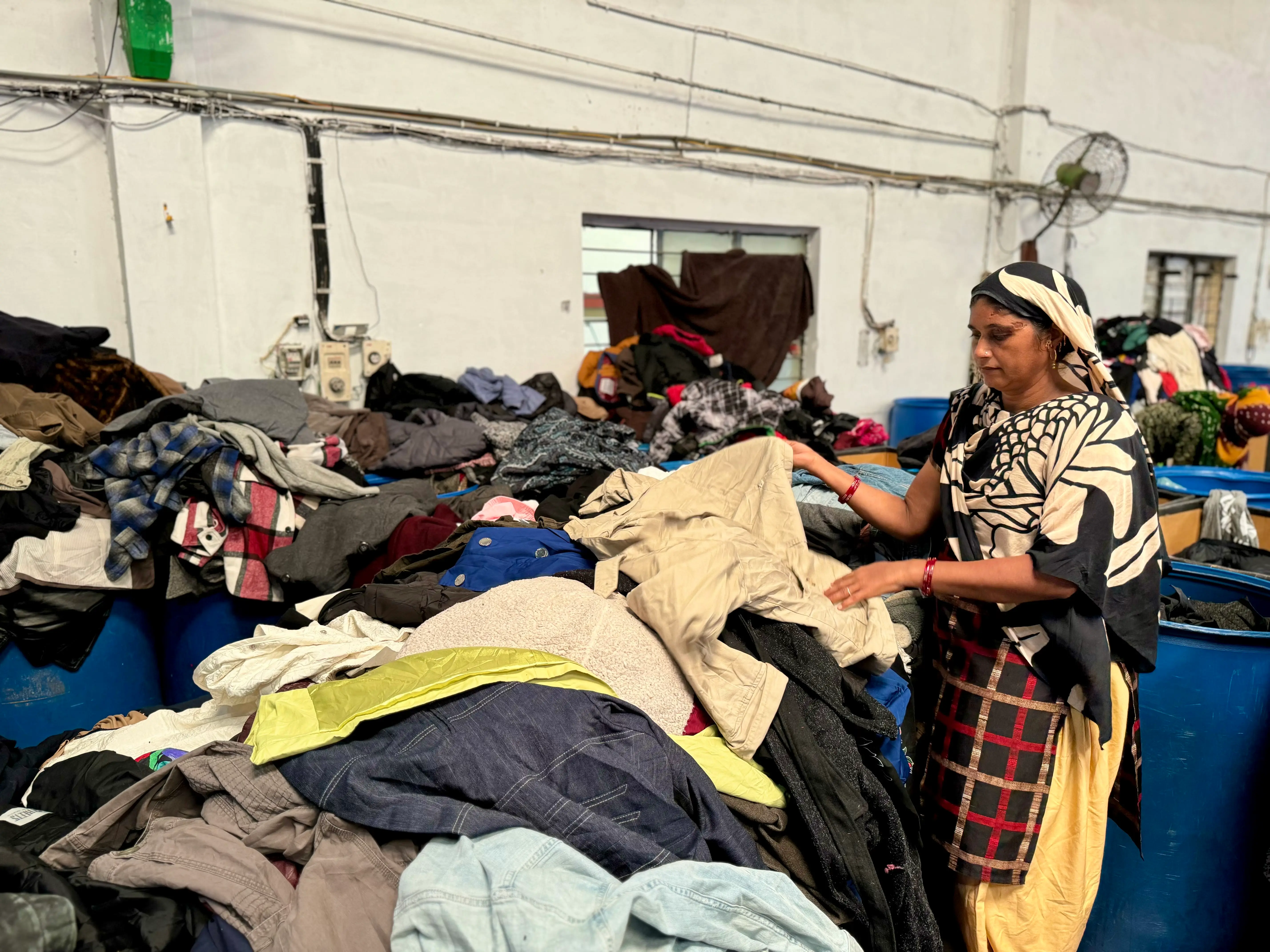 high quality used clothing for winter being sorted