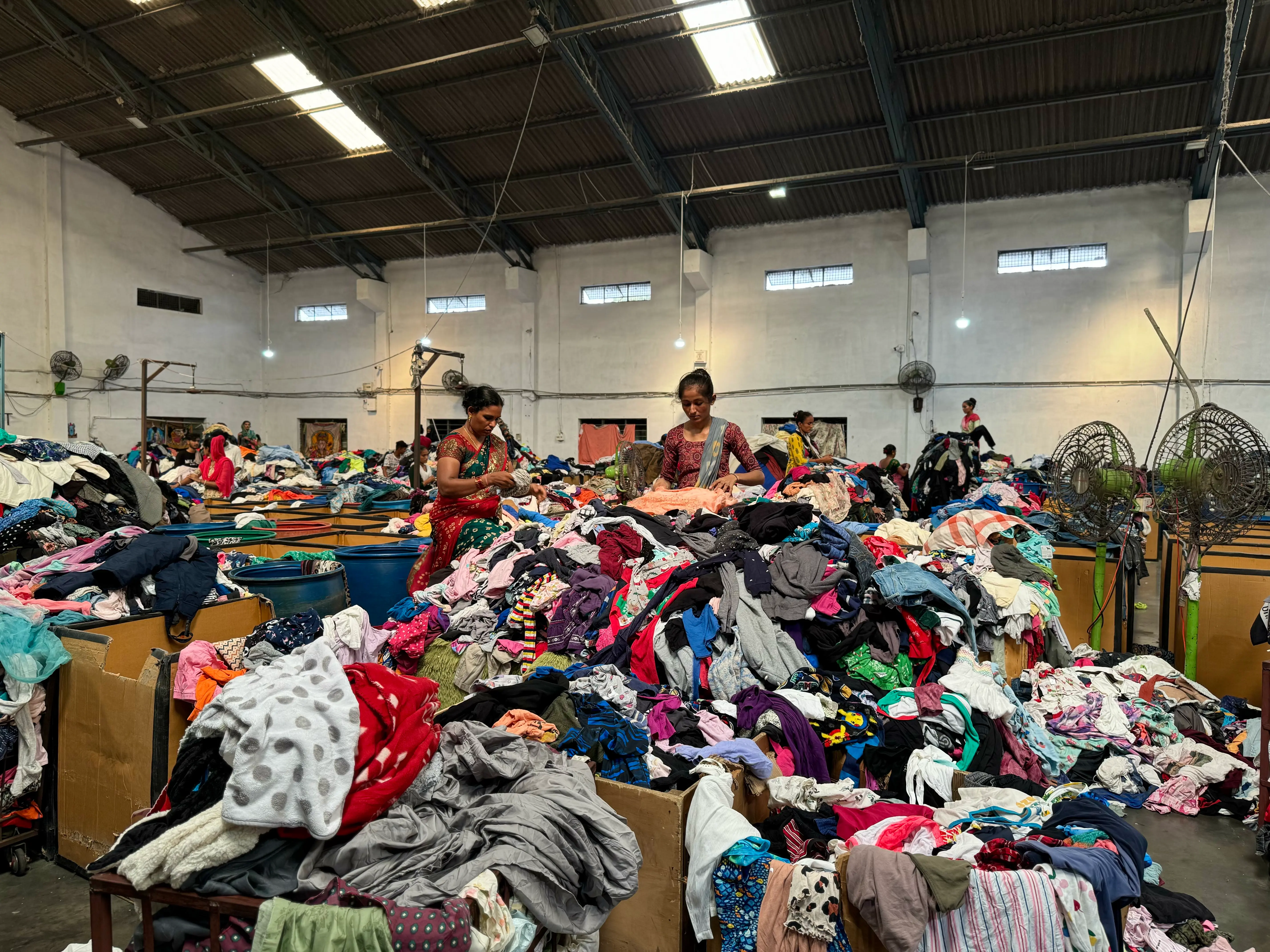 used clothing for baby being sorted